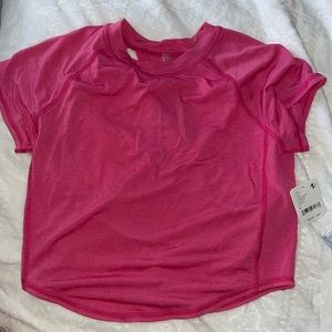 NWT free people movement top with cut outs in the back